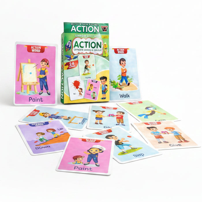 A children's card game set titled 'ACTION' with a green and yellow box and multiple illustrated cards spread out on a light wood surface. The cards show colorful cartoon characters and words such as Paint, Walk, Jump, Give, and UP/DOWN opposites.