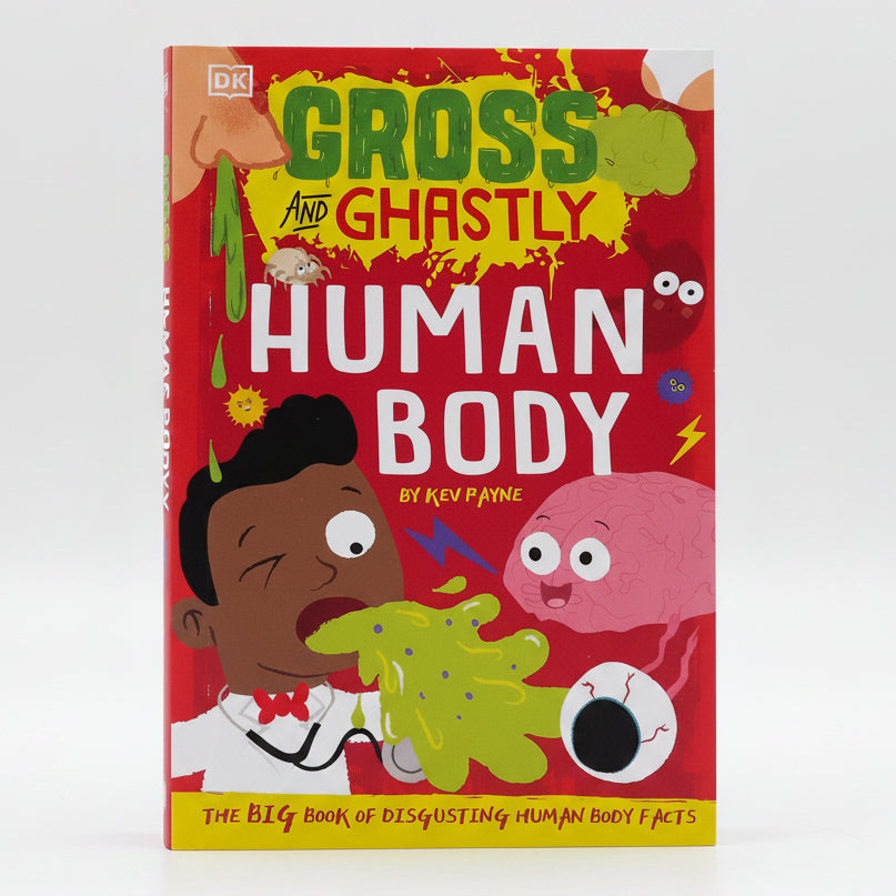 Book titled 'Gross and Ghastly Human Body' on grass