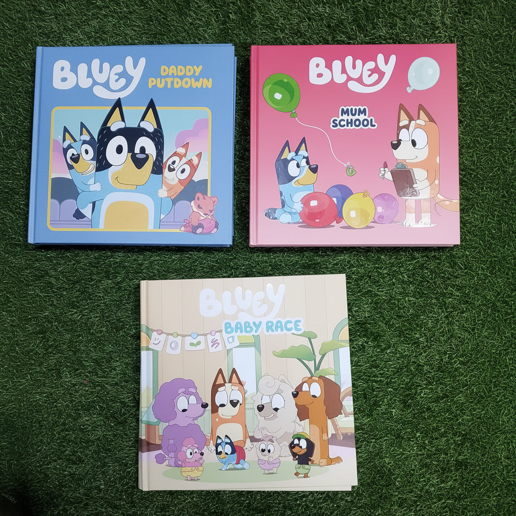 Three children's books titled 'Bluey' on a grassy background