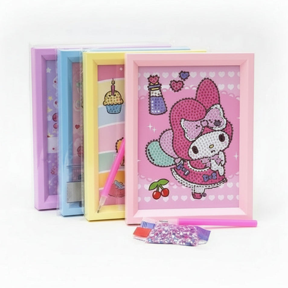 Three colorful diamond painting kits in pink, yellow, and blue frames, with a pink frame in front showing a cartoon character design, displayed on a stone table outdoors.