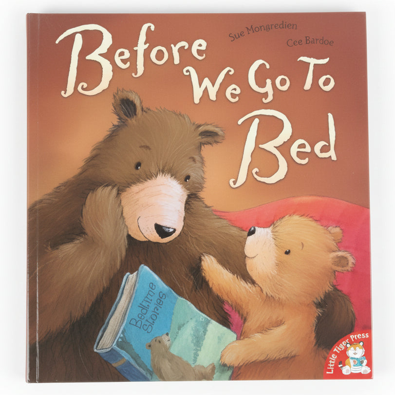 Book titled 'Before We Go To Bed' on a grassy background